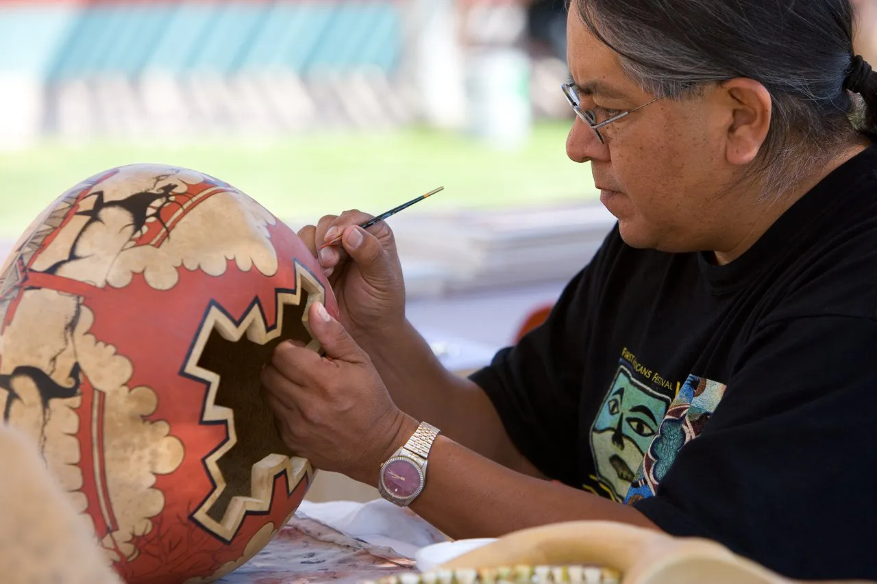 An artist paints traditional pottery in New Mexico.
