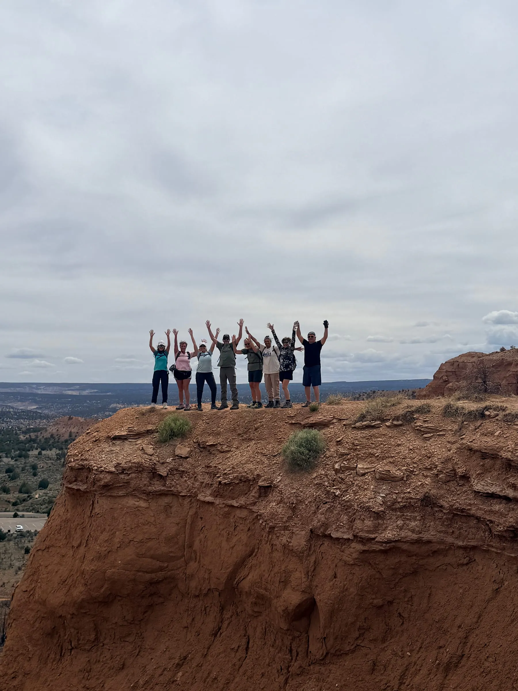The group celebrating on a canyon rim, Grand Staircase-Escalante