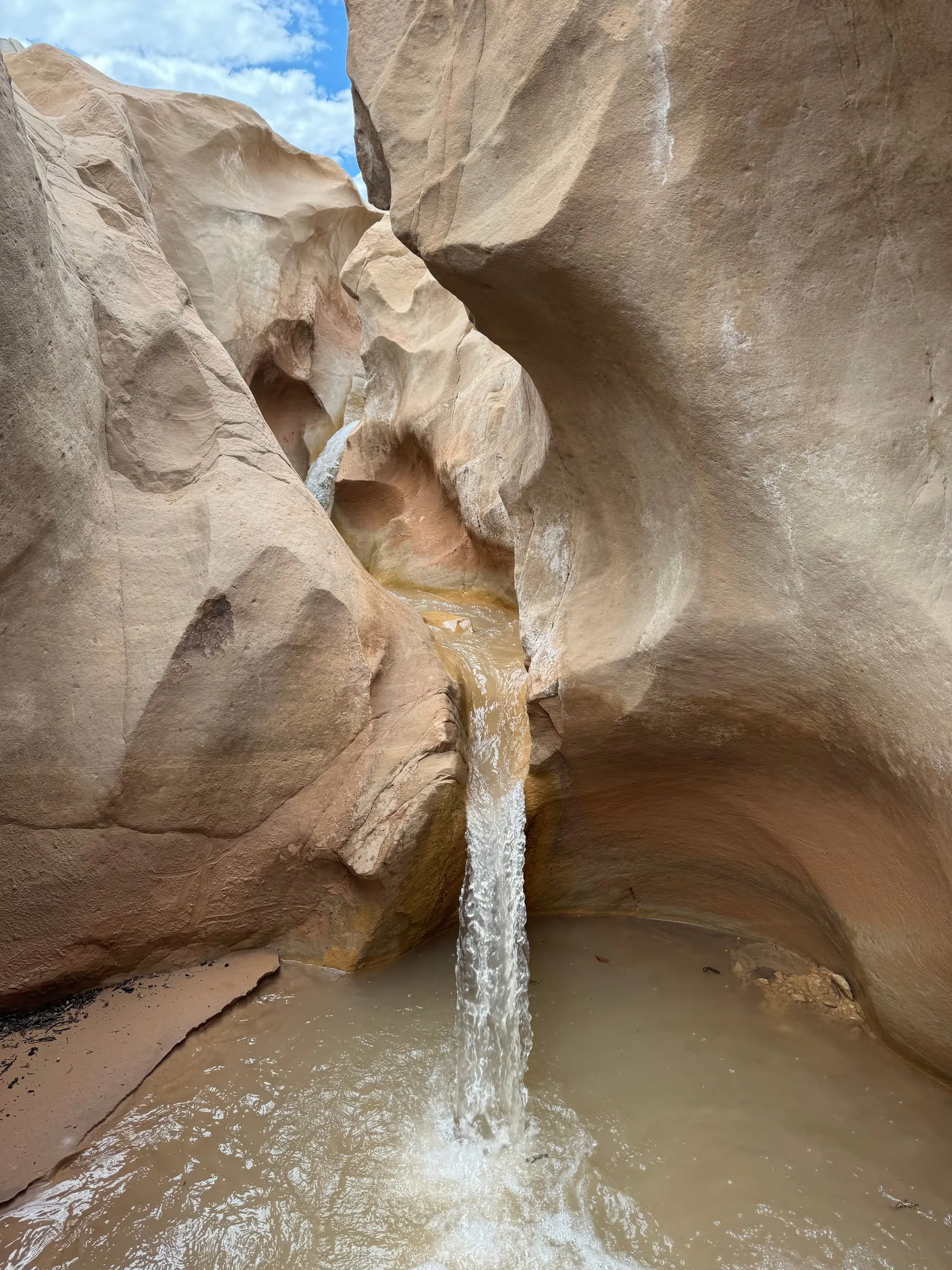 A small waterfall inside a slot canyon