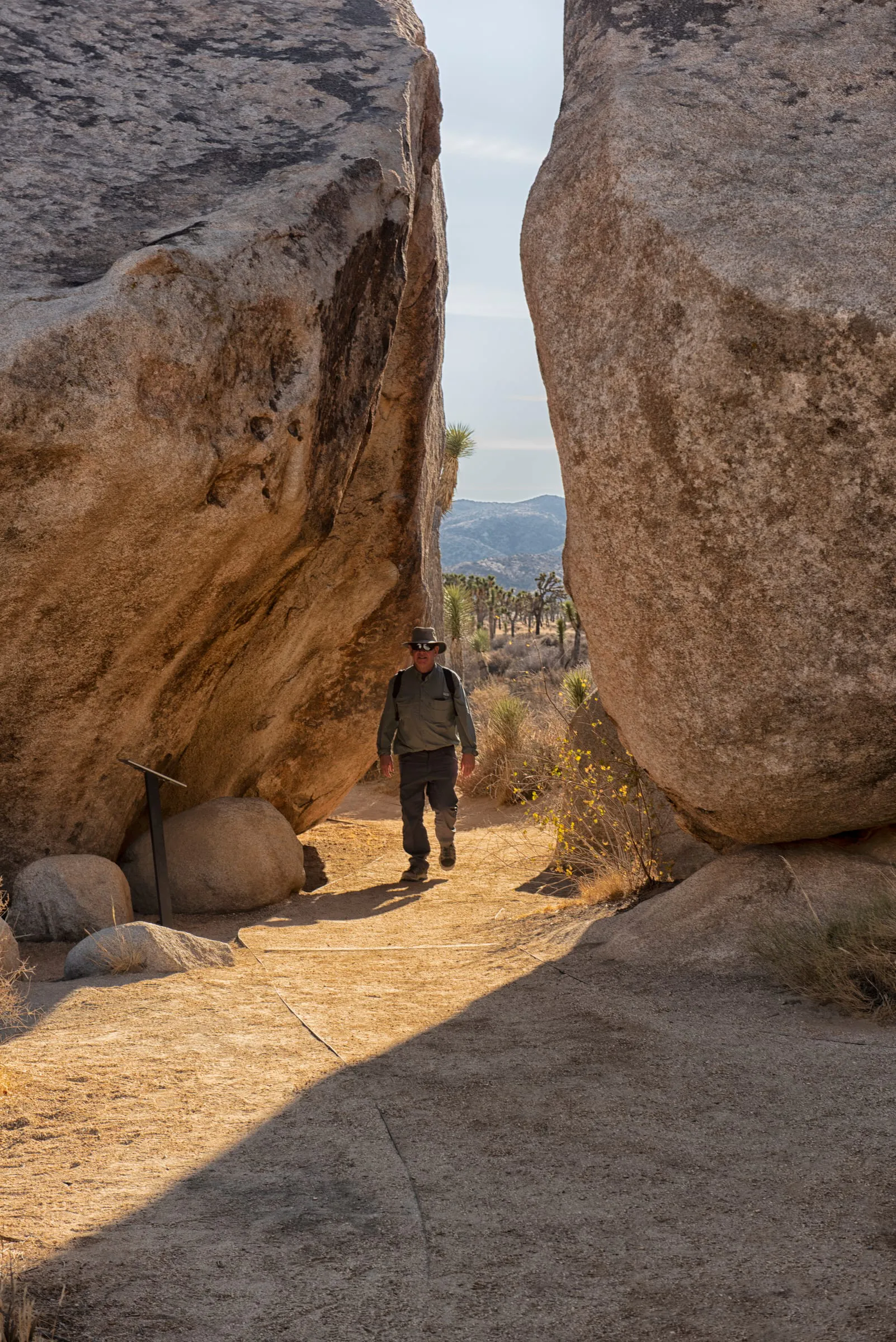 A hiker between the boulders, Joshua Tree National Park